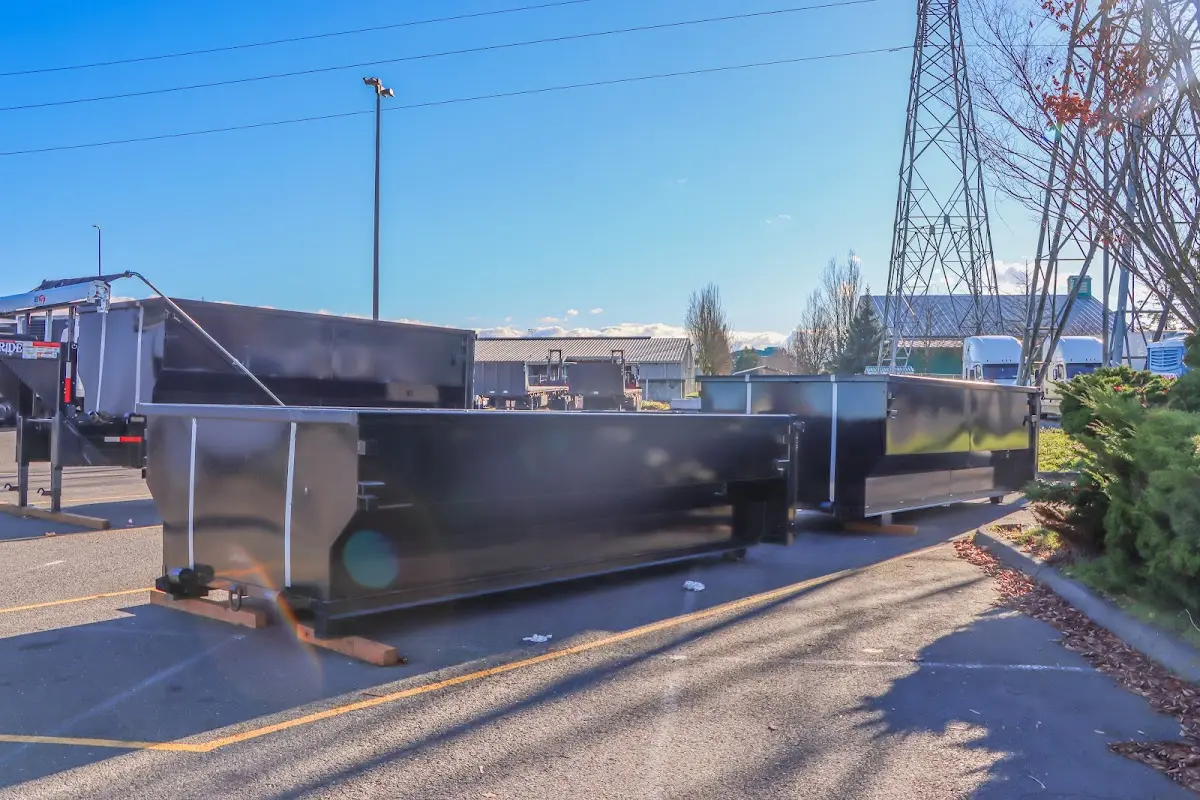 Roll-off dumpster ready for waste disposal at job site for Yard Waste Dumpster Rental in Coos Bay